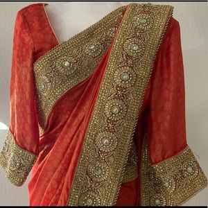 Orange Georgette Saree embedded with Stone